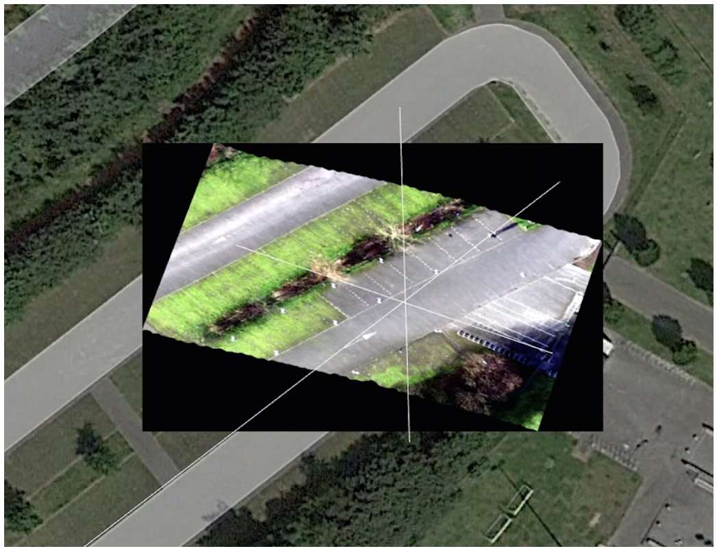 Figure 13: The base image is a georectified Google Earth image. In the middle, you can see a Specim AFX line flown with poor IMU alignment Figure 13: The base image is a georectified Google Earth image. In the middle, you can see a Specim AFX line flown with poor IMU alignment